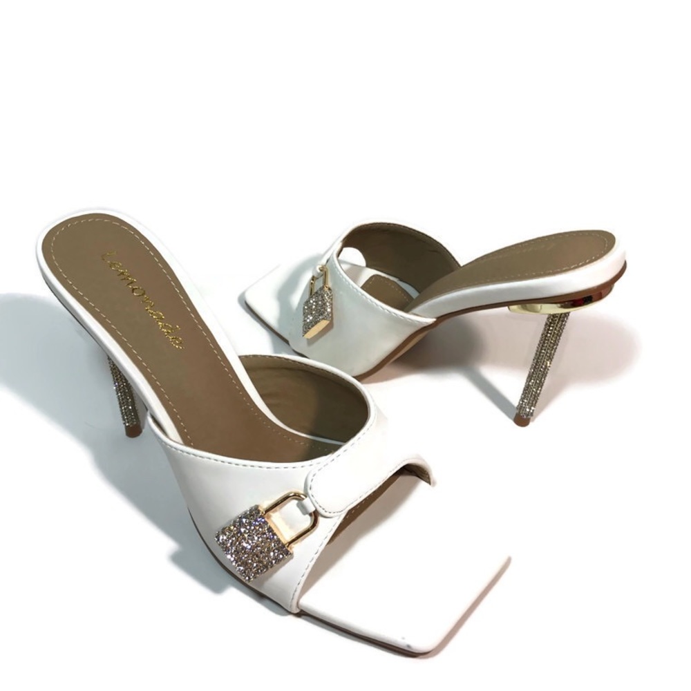 Women’s “White Locked” heels. Sizes 7, 8, 10, and 11.